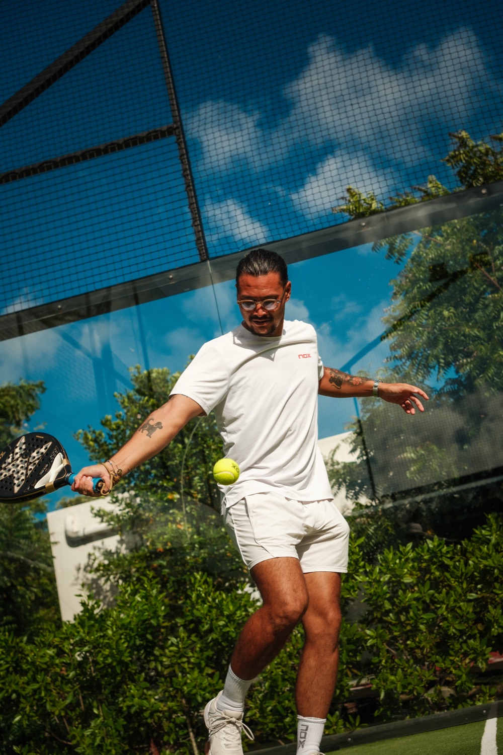 Private padel coaching session on court